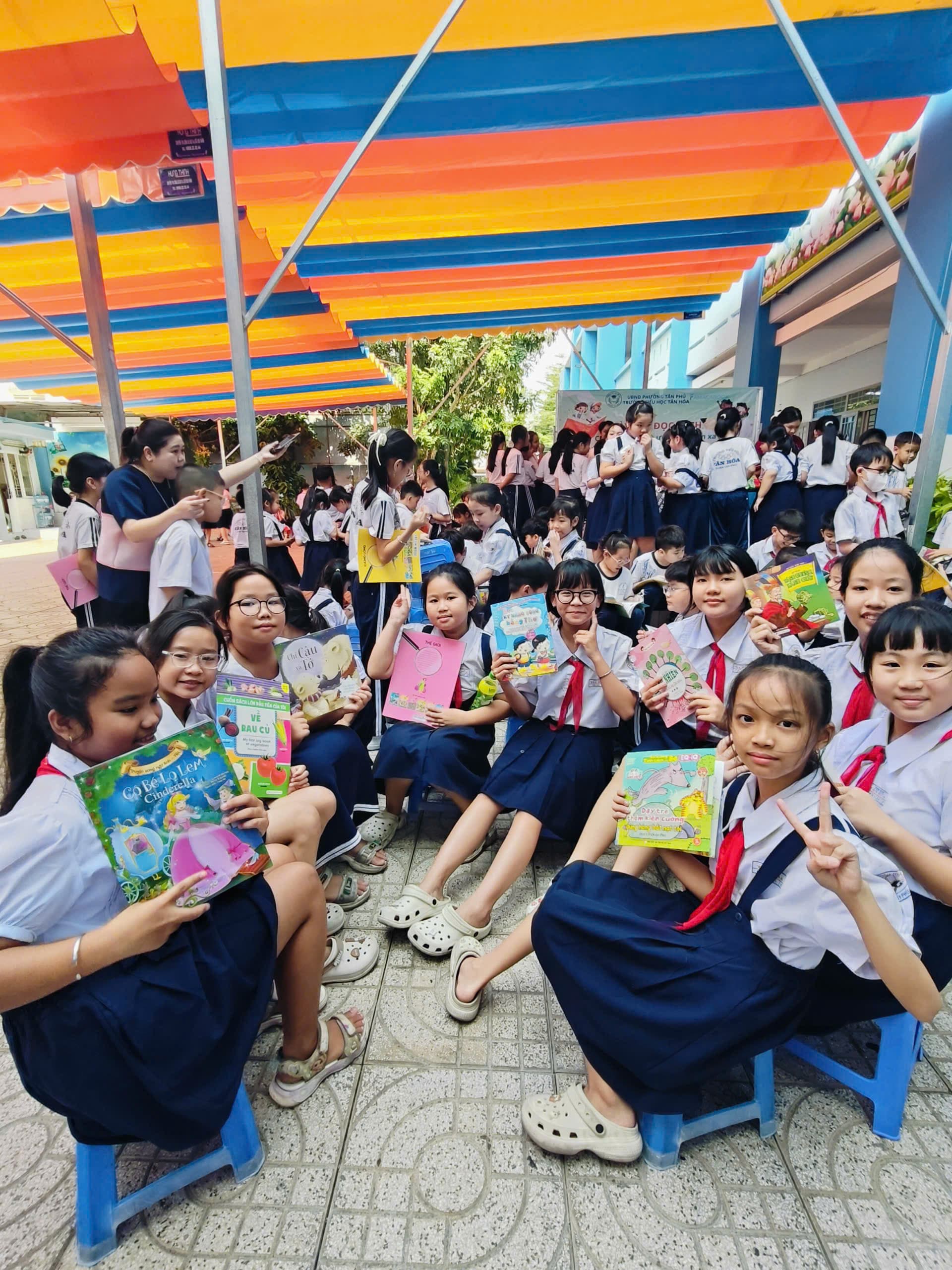 A shared moment capturing the spirit of the reading day - Tan Hoa Primary School